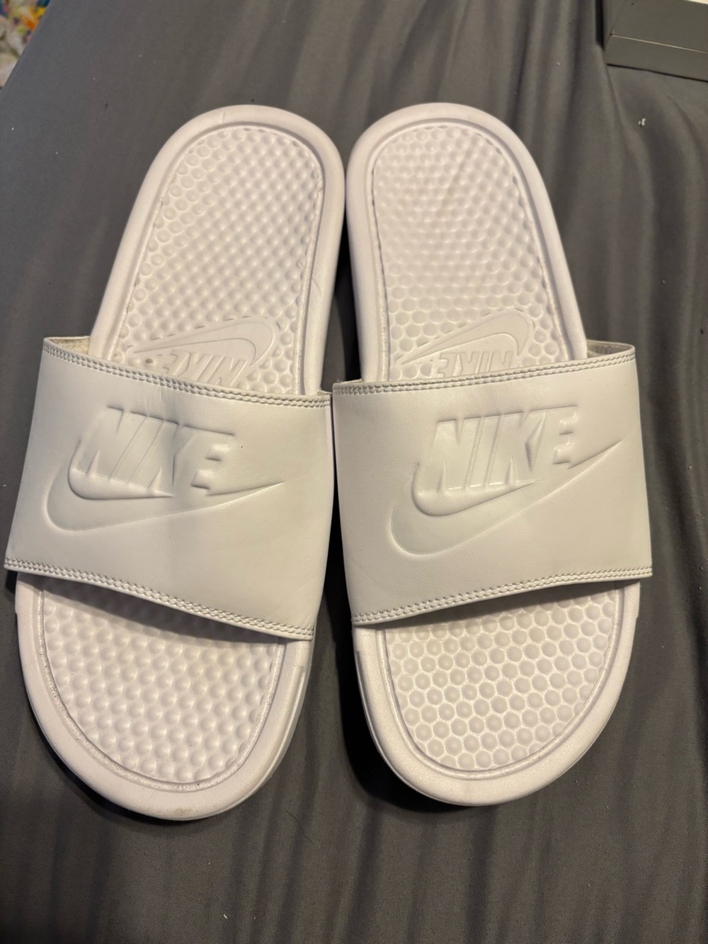 Nike White Slide Sandals with Embossed Swoosh
